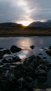 Preview wallpaper stones, lake, grass, hills, sunset