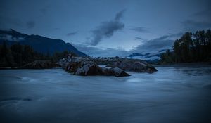 Preview wallpaper stones, lake, sky, clouds, evening, landscape