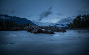 Preview wallpaper stones, lake, sky, clouds, evening, landscape