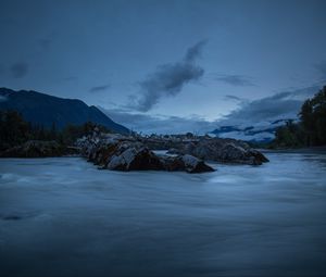Preview wallpaper stones, lake, sky, clouds, evening, landscape