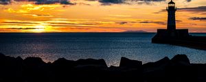 Preview wallpaper stones, lighthouse, silhouette, sea, twilight