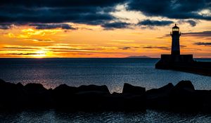 Preview wallpaper stones, lighthouse, silhouette, sea, twilight