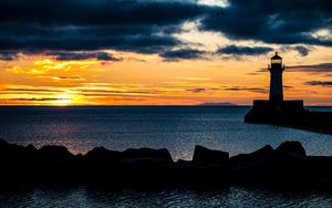 Preview wallpaper stones, lighthouse, silhouette, sea, twilight