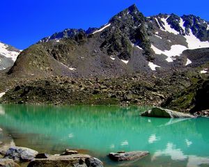 Preview wallpaper stones, mountains, rubble, water, lake