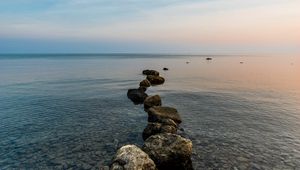 Preview wallpaper stones, pebbles, sea, horizon, sky