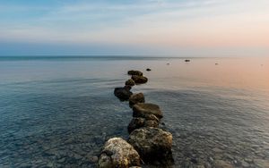 Preview wallpaper stones, pebbles, sea, horizon, sky