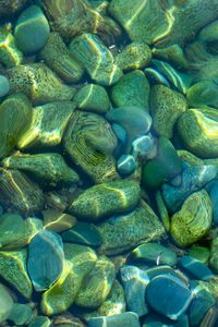 Preview wallpaper stones, pebbles, water, glare, distortion