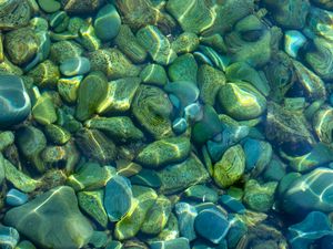 Preview wallpaper stones, pebbles, water, glare, distortion