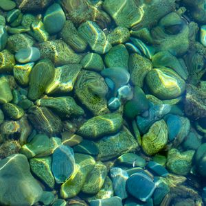 Preview wallpaper stones, pebbles, water, glare, distortion