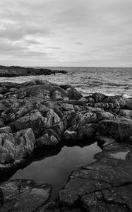 Preview wallpaper stones, reefs, sea, water, horizon, black and white