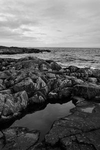 Preview wallpaper stones, reefs, sea, water, horizon, black and white