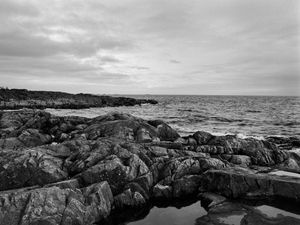 Preview wallpaper stones, reefs, sea, water, horizon, black and white