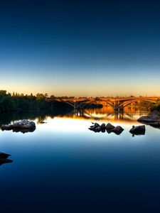 Preview wallpaper stones, river, bridge, morning, water smooth surface, dawn