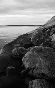 Preview wallpaper stones, rock, sea, black and white, landscape