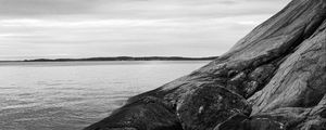 Preview wallpaper stones, rock, sea, black and white, landscape