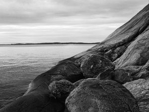 Preview wallpaper stones, rock, sea, black and white, landscape