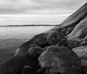Preview wallpaper stones, rock, sea, black and white, landscape