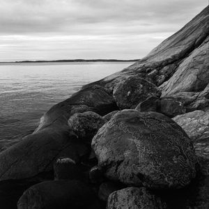 Preview wallpaper stones, rock, sea, black and white, landscape