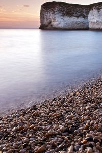 Preview wallpaper stones, rock, sea, smooth surface, coast