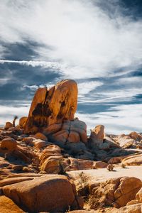 Preview wallpaper stones, rocks, field, clouds, sky, nature