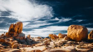 Preview wallpaper stones, rocks, field, clouds, sky, nature