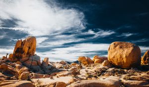 Preview wallpaper stones, rocks, field, clouds, sky, nature