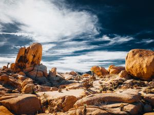Preview wallpaper stones, rocks, field, clouds, sky, nature