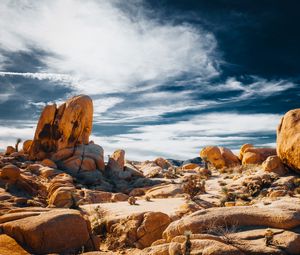 Preview wallpaper stones, rocks, field, clouds, sky, nature