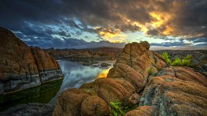 Preview wallpaper stones, rocks, mountains, river, sunset, sky