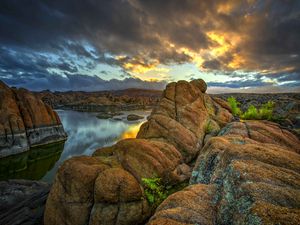 Preview wallpaper stones, rocks, mountains, river, sunset, sky