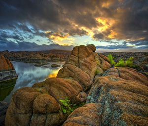 Preview wallpaper stones, rocks, mountains, river, sunset, sky