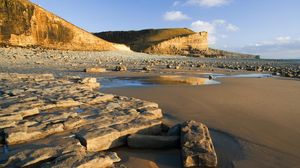 Preview wallpaper stones, rocks, sand, sea, coast, shadows