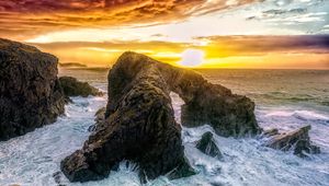 Preview wallpaper stones, rocks, sea, horizon, sunset, clouds, nature