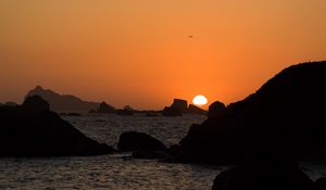 Preview wallpaper stones, rocks, sea, sunset, dark