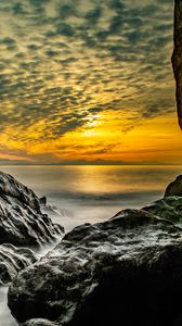 Preview wallpaper stones, rocks, sea, horizon, evening