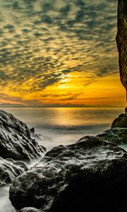 Preview wallpaper stones, rocks, sea, horizon, evening