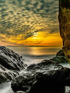 Preview wallpaper stones, rocks, sea, horizon, evening