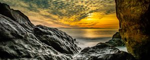 Preview wallpaper stones, rocks, sea, horizon, evening
