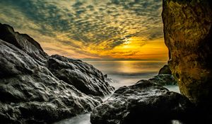 Preview wallpaper stones, rocks, sea, horizon, evening