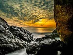 Preview wallpaper stones, rocks, sea, horizon, evening