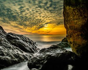 Preview wallpaper stones, rocks, sea, horizon, evening