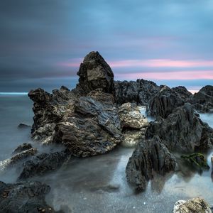 Preview wallpaper stones, rocks, water, sunset, nature