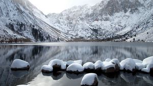 Preview wallpaper stones, row, snow, mountains, lake, distance