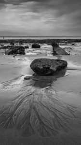 Preview wallpaper stones, sand, sea, bw