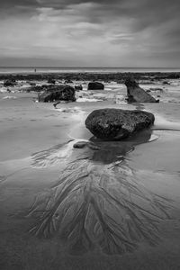 Preview wallpaper stones, sand, sea, bw