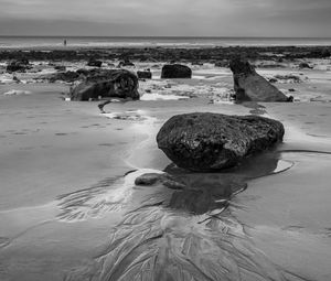 Preview wallpaper stones, sand, sea, bw