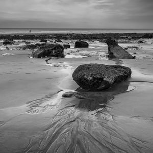 Preview wallpaper stones, sand, sea, bw