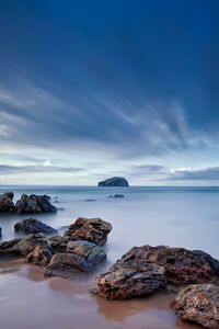 Preview wallpaper stones, sand, sea, beams, sky