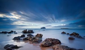 Preview wallpaper stones, sand, sea, beams, sky