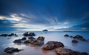 Preview wallpaper stones, sand, sea, beams, sky